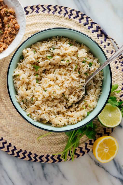 This cilantro lime brown rice tastes just like Chipotle's! It's a staple in my kitchen. #brownrice #cilantrolimerice #wholegrains #mexicanrecipe #cookieandkate Lime Brown Rice, Cilantro Lime Brown Rice, Healthy Brown Rice, Rice Cookies, Brown Rice Recipe, Cookie And Kate, Brown Rice Recipes, Lime Rice, Cilantro Lime Rice