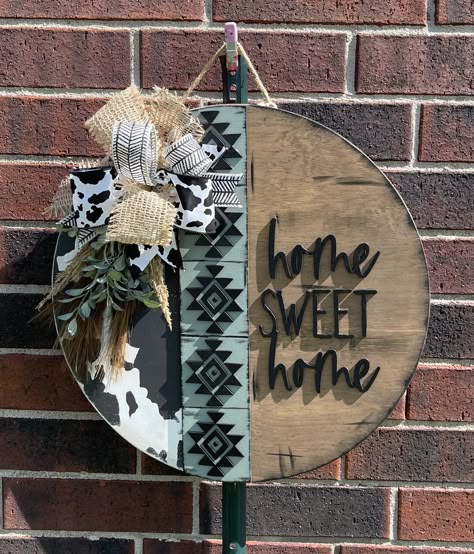 Western Aztec round door hanger.  Who doesn't love a cute western style?  This cute door hanger will welcome your guests and show off your western style.  SIZE:  This sign is an 18-inch wood round door hanger. Thickness is 1/2 inch. WOOD:  This door hanger is made from real birch wood. There may natural blemishes, wood grain and knots since it is real wood. This allows for the character of the wood to shine.  DESIGN:  This wood round is hand painted and stained  and may be distressed.  The wording and Aztec strip is laser cut wood about 3mm thick and adhered with wood glue and may have small nail brads to hold them. The final touches are a wired ribbon bow and greenery. (Ribbon may vary slightly, depending on availability) It comes ready to hang with a jute rope.  FINISHING TOUCH: This doo Gnome Front Door Sign, Western Wooden Signs, Checkered Door Hanger, Leopard Print Door Hanger, Door Hangers Wooden Diy, Wooden Circle Signs Diy, Western Door Hangers, Diy Signs For The Home, Diy Wood Craft Ideas