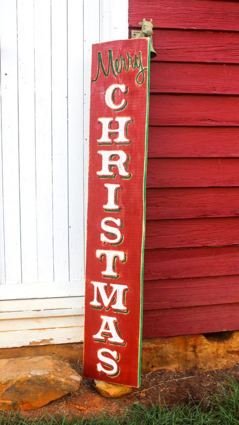 "Add a festive touch to your porch this holiday season with this handcrafted solid wood sign. The sign features the words \"Merry Christmas\" in bold, festive letters that are sure to catch the eye of anyone who passes by. The sign is designed to be hung vertically and comes with a hanger for easy installation. This sign is carved and finished in our North Carolina studio with a signature rustic, distressed finish that will suit many décor styles. The dimensions of this large sign are approximat Christmas Diy Wood, Large Sign, Merry Christmas Sign, Christmas Signs Wood, Wood Rustic, Barn Quilt, Christmas Sign, Stenciling, Christmas Wood