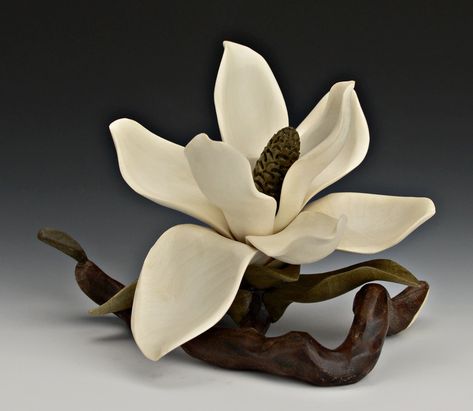 Flowers and leaves carved in wood. Nature wood carvings Flowers Magnolia, Holly Flower, Holly Branch, Magnolia Branch, Carved Flowers, Painted Coffee Mugs, Flower Sculptures, Flower Carving, Wood Flowers