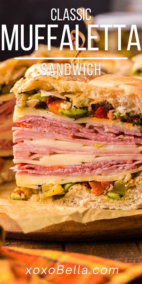 A well-made muffaletta sandwich with olive spread, deli meats and cheese is one of life’s culinary delights! It’s easy to make a muffaletta recipe yourself at home and it’s hard to beat this classic New Orleans sandwich. This show-stopping sandwich is guaranteed to satisfy even the heartiest appetite. Traditional muffaletta is the perfect combination of tasty ingredients. Boasting homemade olive spread along with delicious Italian deli meats and cheese, this is the ultimate sandwich. Muffaletta Bread, Muffaletta Recipe, Muffuletta Recipe, Muffaletta Sandwich, Ultimate Sandwich, Muffuletta Sandwich, Tailgate Recipes, Olive Spread, Slow Cooker Italian Beef