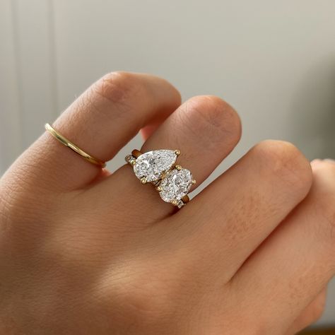 5 unique style trends our clients are choosing to make their rings stand out a little extra✨ 1. UNIQUE SIDE STONES & CUTS Unique cuts such as trapezoid, half-moon, trillian, and baguette cuts can complement and enhance the centre stone and brings more sparkle and dimension. Featured 1.50ct Hexagon cut with Kite sides stones | Bespoke 2. EAST WEST SET ELONGATED STONES Setting elongated stones like emerald, marquise, or oval cuts horizontally (east-west) across the band rather than the trad... Unique Wedding Ring Sets, Rings Stand, Engament Rings, Different Gemstones, Most Beautiful Engagement Rings, Dream Rings, Period Piece, Ring Inspo, Tiny Beads