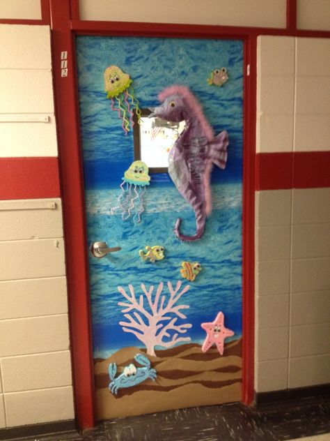 Classroom Art door. Seahorse, jellyfish, crab, starfish, ocean theme Mermaid Classroom Door, Sea Door Decorations Classroom, Jellyfish Door Decoration, Ocean Theme Preschool Classroom Door, Ocean Theme Hallway, Ocean Themed Door Decorations, Starfish Door Decorations Classroom, Classroom Door Sea Theme, Ocean Bulletin Board