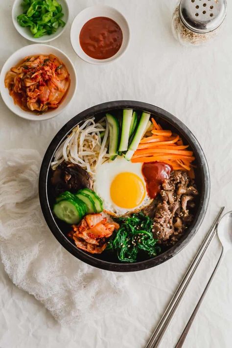 Korean bibimbap mixed rice with chopsticks and spoon on the side. Bibimbap Recipe Chicken, Bibimpab Korean, Korean Healthy Recipes, Kimbap Aesthetic, Korean Egg Rice, Korean Food Bibimbap, Korean Meals, Savoury Rice, Dolsot Bibimbap