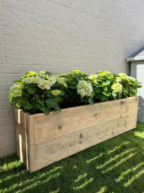 Modern rustic reclaimed wooden garden planter. Made from reclaimed scaffold boards.  Ideal for outdoor plants, flowers, herbs and vegetables. Features holes for drainage and is positioned on top of small wooden feet.  Pictures of the example pieces may slightly vary, as each piece of reclaimed wood is different and reacts differently to stains/oils. The time of the year also has an effect on the woods natural colour too. Our pieces are coated in Osmo Poly oil then second coated in clear boiled l Garden Troughs, Herb Boxes, Garden Planter, Wooden Planters, Wood Planters, Garden In The Woods, Planter Box, Garden Boxes, Garden Bed