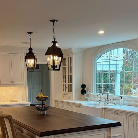 The Cozy Colonial | DeAnna Martino on Instagram: "Swipe for the before! Adding sconces on each side of the window this week but had to show this view again with our pendants up. I love how every detail we add brings the space together more and more. Also ordered a rug runner and then the kitchen should just about be done! I’ve been trying to focus on one room at a time otherwise it becomes too overwhelming and I don’t get anything done. What room should I focus on next? 🤔

#kitchen #kitchendesign #kitchendecor #kitchenremodel #kitchenrenovation #kitchenrenovation #kitcheninspiration #kitchencabinets #customcabinetry #kitchengoals #kitcheninspo #homerenovation #colonial #beforeandafter #interiordesigner #colonialhome #renovationproject #homedecor #homedesign #traditionalhome #traditional # Gorgeous Kitchens, Colonial House, Custom Cabinetry, Renovation Project, Traditional House, Kitchen Renovation, The Window, Kitchen Inspirations, Home Renovation