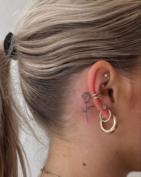 Small rose tattoo, behind the ear tattoos Fine Line Rose Tattoo Behind Ear, Small Red Rose Tattoo Behind Ear, Minimal Tattoo Behind Ear, Red Ink Rose Tattoo Behind Ear, Cute Tattoo Behind Ear, Dainty Rose Tattoo Behind Ear, Behind The Tattoos Ear, Behind Ear Fine Line Tattoo, Cute Behind Ear Tattoo