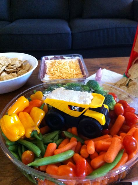 Veggie tray with dump truck dip Construction Theme Veggie Tray, Veggie Tray Construction Party, Construction Bday Party Food, Im Digging Being 2 Birthday Cake, Trucks 1st Birthday Theme, Dump Truck Centerpiece Ideas, Construction Birthday Party Veggie Tray, Construction Theme Fruit Tray, Construction Ice Cream Cake