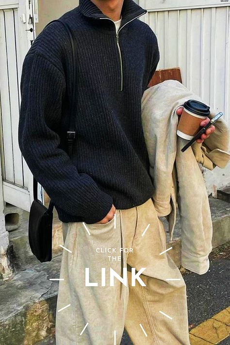 A Korean men wearing street style outfit like dark grey zip sweatshirt, Beige Pants and a phone.