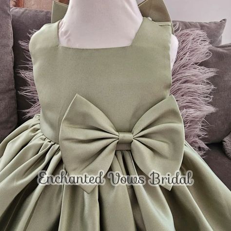 Gorgeous, Olive Green Satin Flower Girl Dress (Various Colours) - Wedding, Communion, Baptism, Party DressBridesmaid Dress - Wedding This beautiful Olive Green satin dress is available in a variety of colours. A simple but elegant dress in a satin feel fabric (polyester) with a bow on the front, and a large bow n the back that can detach. The back is zip up. #flowergirldress #flowergirl #olivedress #satindress #sagegreendtesd #partydress #birthdaydress #fyp #fypviral free #etsyshop #e... Olive Green Satin Dress, Wedding Communion, Green Satin Dress, Satin Flower Girl Dress, Princess Flower Girl Dresses, Puffy Dresses, Olive Dress, Baptism Party, Satin Flowers