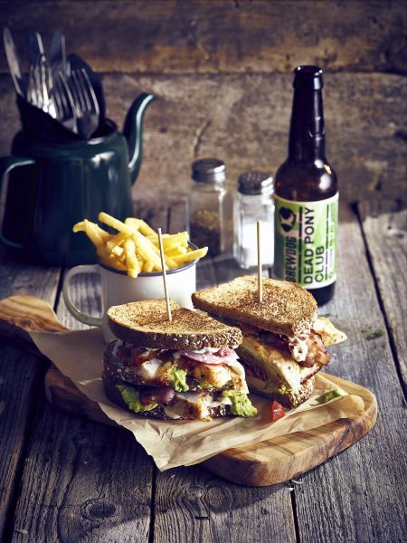 The Classic Club Sandwich, a pub favourite served on a wooden board with a cup of chips Pub Classic Food, Club Sandwich Photography, Pub Sandwiches, Gastro Pub Food, Pub Chips, Menu Photography, Gastro Pub, Pub Grub, Beer Photography