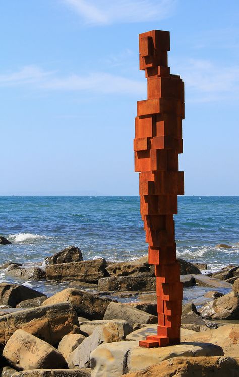 Life-sized sculptures by Antony Gormley at Kimmeridge Bay Dorset oin 2015. Five sites around the UK were specially selected by the artist and each cast-iron sculpture was designed to complement its surroundings.   The commission - entitled Land - was created to mark 50 years of UK building conservation charity Landmark Trust. The nearby Clavell Tower that was moved & renovated by the Trust stands on the cliff above.  Photo rights reserved: Ann Collier Brick Sculpture Art, Kimmeridge Bay, Antony Gormley Sculptures, Anthony Gormley, Plaza Design, Iron Sculpture, Landmarks Art, Antony Gormley, Public Sculpture