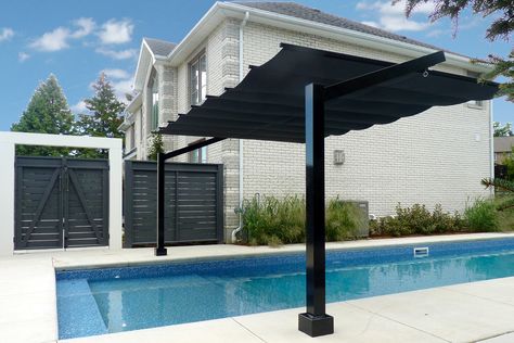 Homeowners can now enjoy the shade without having to leave the pool. They also have added UV protection. With the flexibility of retracting the shade on either side, pool loungers can decide when they want shade or open sky. #retractableshade #outdoorliving #retractableawning #retractablecanopy #backyardpatio #sunprotection #outdoorstructures #moderndesign #backyardretreat #rainprotection #waterproofcanopy #backyardrenovations  #moderumbrella #waterproof #pooldesign Over Pool Shade Ideas, Retractable Pool Shade, Pool Canopy Ideas, Pool Shade Structure, Shade For Pool, Pool Shade Ideas, Pool Sun Shade, Pool Ledge, Pool Canopy