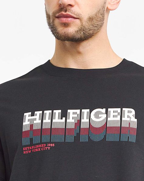 Tommy Hilifiger crew-neck t-shirt with a retro-style fade logo graphic on the front. Made with high quality pure cotton, featuring signature branding on the back of the neck and sleeve cuff. Tommy T Shirt, Minimalist Tshirt, Balenciaga T Shirt, Polo Club, Sleeve Cuff, Style Minimalist, Pierre Cardin, Logo Graphic, Logo T Shirt