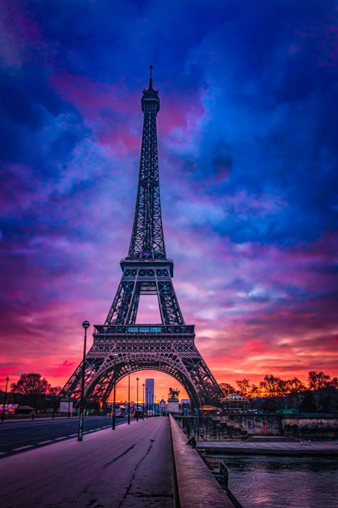 Title: Sunset at the Eiffel Tower Immerse yourself in the timeless beauty of Paris with this stunning fine art photograph capturing the Eiffel Tower at sunset, viewed from across Seine and the Pont d'Iéna. The sky is a mesmerizing canvas of deep blues and rich reds, with clouds adding texture and depth to the breathtaking scene. The iconic silhouette of the Eiffel Tower stands majestically against the vibrant colors, creating a perfect blend of natural and architectural splendor. Bring a piece o Photo Ciel, France Landscape, Eiffel Tower Photography, Beautiful Summer Wallpaper, Cute Summer Wallpapers, Beautiful Ocean Pictures, Ocean Pictures, Paris Pictures, The Seine