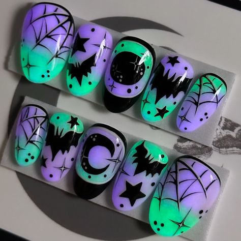 Who needs a flashlight when your nails are this lit? Shine on, spooky friends! 💚🦇✨💜 Witching Hour on Après Short Round 🥺💅🏻 ⁣ .⁣ .⁣ .⁣ .⁣ .⁣ #glowinthedarknails #glownails #lovebats #spiderwebnails #batsnails #spookyszn #boo #gothnailsofinstagram #halloweenmanicure #spookyseason #moonandstars #purplenails #shortnails #halloweennailsdesign #halloweennails #shortpressons #halloweennailart #spookynails #nailartist #pressonnailset #halloweenideas #glowinthedarknails💅 #happyhalloween #batnails #gl... Pastel Goth Nails Short, Hotel Transylvania Nails, Pastel Goth Nails, Nail Halloween, Bat Nails, Spooky Nails, Halloween Manicure, Cute Halloween Nails, Goth Nails