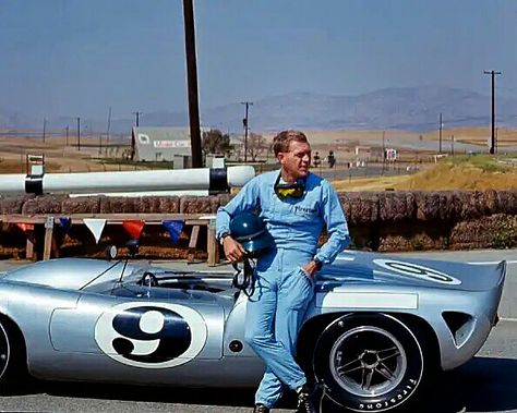 Steve McQueen, in a Firestone racing suit, leans against a Lola T70 SL70/14 Can-Am car at Riverside Raceway, Riverside, California, July 1966. The hot setup for Can-Am racing was a T70 Chevrolet V8, and the Lola cars took a big endurance win with a one–two finish in the 1969 24 Hours of Daytona. McQueen was a serious sports car racer, taking two SCCA Nationals and a 2nd place finish at the 12 hrs of Sebring in a Porsche 908. #SteveMcQueen #LolaT70 #SCCA Riverside Raceway, Actor Steve Mcqueen, Steve Mcqueen Style, Steven Mcqueen, Steve Mc, Mc Queen, Car Racer, Classic Racing Cars, Ford Gt40