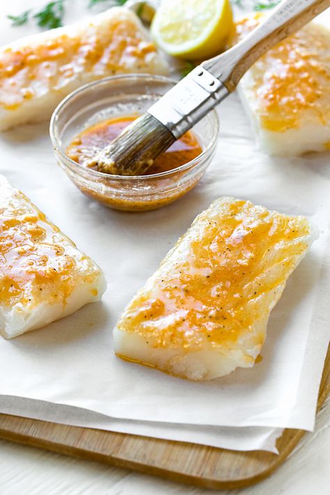 Halibut is first brushed with lemon, garlic, Dijon and paprika before baking for this succulent baked halibut recipe! | thecozyapron.com #bakedhalibut #bakedhalibutrecipes #bakedhalibutoven #bakedhalibutrecipeshealthy #bakedhalibutrecipeslemon #bakedhalibutrecipesoven How To Cook Halibut, Halibut Recipes Baked, Baked Halibut, Halibut Recipe, Halibut Recipes, Fish Recipes Baked, Fish Dinner Recipes, Recipes Fish, Fish Recipes Healthy