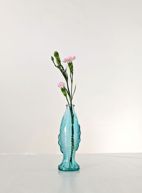 Blue fish vase with flowers. Perfect sustainable Christmas gift ideas Fish Vase Ideas, Sustainable Christmas Gifts, Pale Blue Dresses, Vase Ideas, Fish Vase, Cotton Lace Tops, Champagne Saucers, Vase With Flowers, Sustainable Christmas