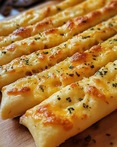 These Cheesy Garlic Breadsticks are a family favorite! They're cheesy, garlicky, and disappear in seconds!  Ingredients: - Pizza dough - Garlic butter  - Mozzarella cheese   For the rest of the delicious details, Link in first comment [👇] [👇]  Everyone I know loves these. They're quick, easy, and perfect for sharing!   #CheesyGarlicBreadsticks #ComfortFood #Homemade #Yummy #EasyRecipes Garlic Fingers, Cheesy Garlic Breadsticks, Cheesy Garlic Breadsticks Recipe, Cheese Stick, Garlic Breadsticks, Cheese Sticks, Cheesy Recipes, Yummy Comfort Food, Edible Food