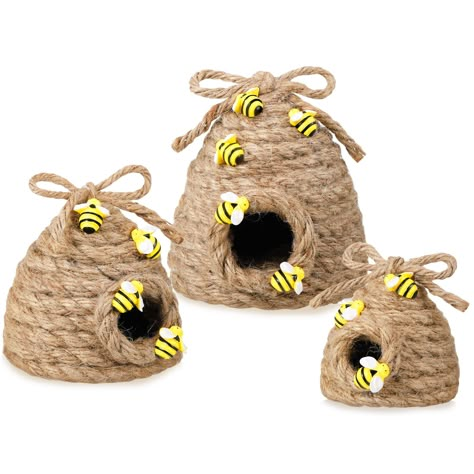 PRICES MAY VARY. Lovely Beehive Decor: our jute bee hive decor is decorated with bows on the top and some buzzing bee designs on the body, the lifelike, delicate design of the bee is very eye catching, fresh, and lovely, bringing you a happy mood, will add sweetness and warm feeling to your room Summer Breath Set: you will receive 3 pieces of farmhouse bee hive decorations in 3 sizes, respectively, are about 4.53 inches/ 11.5 cm, 3.54 inches/ 9 cm, 2.52 inches/ 6.4 cm both in height and bottom diameter for large, medium and small ones, different sizes can bring more variety to your table decorations Long Serving Time: our summer farmhouse honey bee decor is mainly made of quality woven jute rope materials, with small resin bees in slightly different positions and sizes, lightweight, durabl Bee Skep Decor, Bee Hive Decor, Hive Decor, Bumble Bee Decorations, Bebe Shower, Honey Bee Decor, Small Sunflower, Bee Skep, Home Coffee Bar