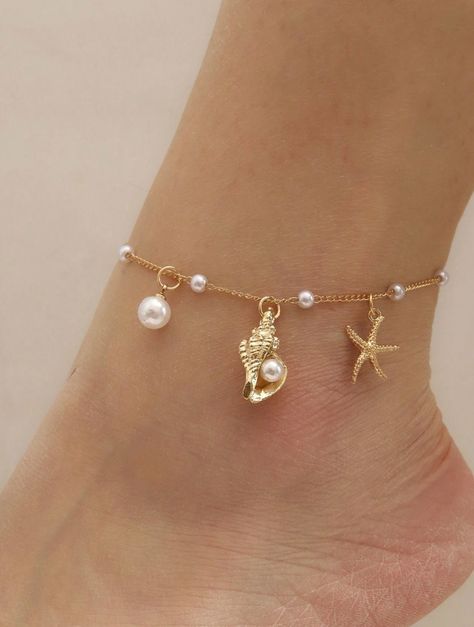 Dive into summer with our Ocean Breeze Anklet, a delicate piece that captures the enchanting beauty of the sea. This dainty gold anklet features a charming starfish, a tiny conch shell, and luminous pearls, evoking the serene vibes of a beach getaway. Lightweight and effortlessly chic, it's perfect for adding a touch of coquette elegance to your summer wardrobe. Embrace the ocean's magic with every step you take! Ocean Jewelry Aesthetic, Beach Jewelry Aesthetic, Gold Dainty Jewelry, Life Gifts, Jewelry Closet, Beach Jewellery, Anklet Gold, Surf Jewelry, Edgy Accessories