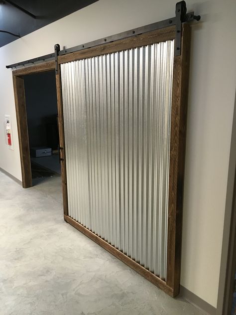 Corrugated metal and rough sawn ship-lapped wood sliding barn door Bar Sliding Door, Metal Shop Door, Corrugated Metal Interior Design, Metal Sliding Door Design Outdoor, Farm Doors Sliding, Metal Door Design Outdoor, Industrial Door Design, Corrugated Metal Projects, Corrugated Metal Door