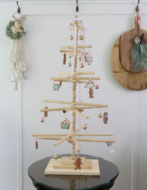 This wooden dowel Christmas tree has that minimalist look I adore with a Scandinavian vibe. It is simple to assemble and will add a fun look to your Christmas decor. Dowel Christmas Tree, Beach Christmas Trees, Trees Diy, Themed Ornaments, Xmas 2022, Pallet Christmas Tree, Christmas Tree Diy, Minimalist Christmas Tree, Pallet Christmas