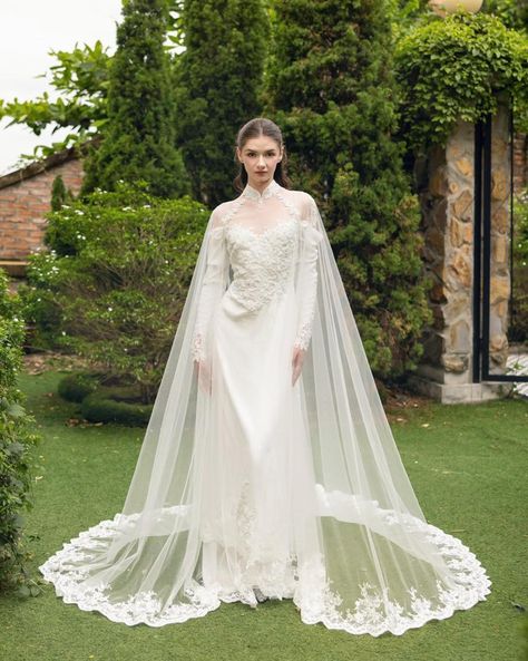 Draped in lace 🤍 Elevate your wedding ensemble with our stunning new bridal cape, designed to add a touch of luxury and elegance to your special day. Whether you're walking down the aisle in a classic wedding dress or a traditional ao dai, this exquisite piece is the perfect accessory to complete your look. Crafted with meticulous attention to detail, our bridal cape offers a blend of timeless sophistication and modern style. The delicate fabric drapes beautifully, providing an ethereal lay... Tulle Cape, Bridal Cape, Dream Dresses, Classic Wedding Dress, Light Ivory, Soft Tulle, Bridal Robes, Draped Fabric, Bridal Veil