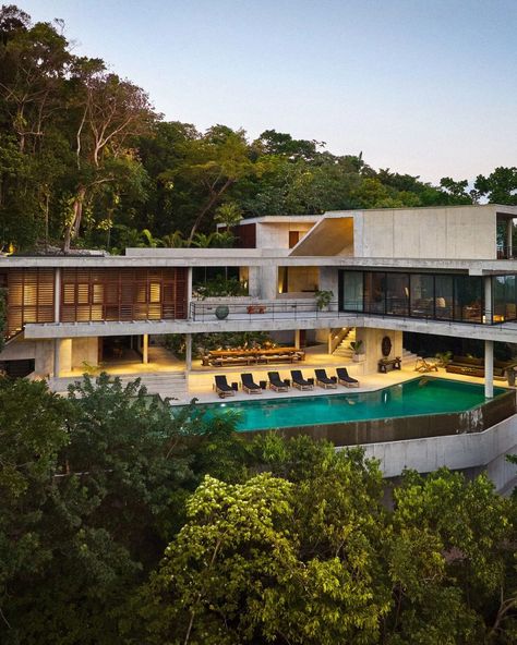 This Jamaican retreat is nestled into its hillside site. Rainwater is collected, treated, and stored beneath the pool. “This is a house that asks people to explore and wander. The views unfold as you ascend ever higher,” says @giawolff. Take a tour of the private jungle paradise in our June cover story at the link in our bio. Photo by @frankfrancesstudio; styling by @tessawatson; architecture by @freecell_architecture and @giawolff; interiors by @saranataf420 and @khinden; landscape design b... House In Jamaica, Jamaica House, Beachfront House, Blue Backsplash, End Grain, Kitchen Window, Summer Design, Home Library, Architectural Digest