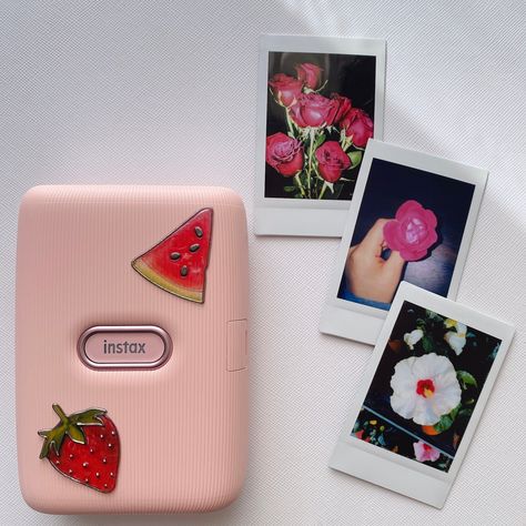 Pink instax printer with three polaroid pictures of flowers Instax Printer Aesthetic, Polaroid Pictures Aesthetic, Visual Wishlist, Polaroid Camera Instax, Instax Ideas, Pinterest Wishlist, Pink Polaroid, Polaroid Printer, Instax Printer