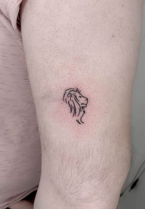 62 Fierce and Beautiful Lion Tattoos For Women Elegant Lion Tattoo, Outline Of A Lion Tattoo, Lions Head Tattoo For Women, Lion Dainty Tattoo, Small Simple Lion Tattoo, Lion Stick And Poke, Micro Lion Tattoo, Lion Mini Tattoo, Lion And Lamb Tattoo For Women