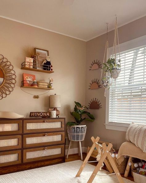 In love with the look of an earth tone nursery? This soon-to-be-mama nailed this on-trend boho nursery design! Get this perfect, neutral look. Boho Nursery Gallery Wall, Nursery Ideas Earth Tones, Neutral Tones Nursery, Boho Nursery Colors, Sunrise Nursery Theme, Earth Toned Nursery, Earth Tone Nursery Girl, Nursery Earth Tones, Neutral Tone Nursery