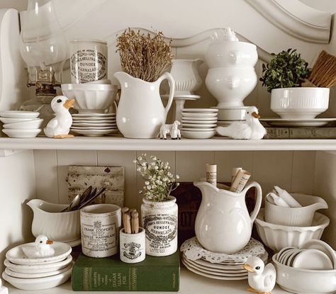 White Farmhouse Hutch, Cottage Shelves, Thrift Decorating, Kitchen Shelf Inspiration, Corner Cabinet Dining Room, Ironstone Display, White Pitchers, Hutch Styling, Shelf Decorating