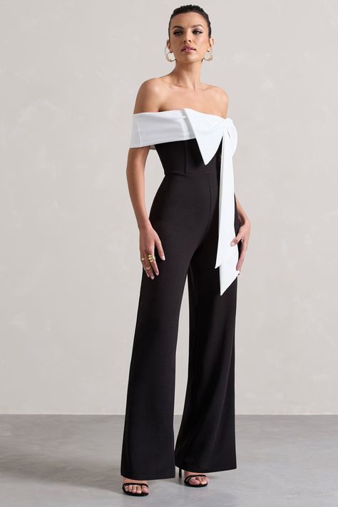 Off-shoulder is never off-season, and our lavish jumpsuit Bower proves that. Designed in a flattering scuba crepe, this straight-leg jumpsuit boasts a contrasting white bardot neckline highlighted by an artful bow detail. From graduations to dinner dates, exude elegance in Bower.Features - Premium scuba crepe- Bow bardot neckline- Invisible zip closure - Straight legSizing & Fit Model is 5'6"5 and wears UK size 8 / US size 4 Product Information Designed exclusively by Club L LondonUnlined with g Pre-tied Satin Bow For Black Tie Events, Formal Black Fitted Bow, Jumpsuit Wedding Dress Big Bow, Formal Black Detachable Bow, Elegant Black Strapless Jumpsuit With V-neck, Club L London, Bardot Neckline, Dinner Dates, Black Dress Prom