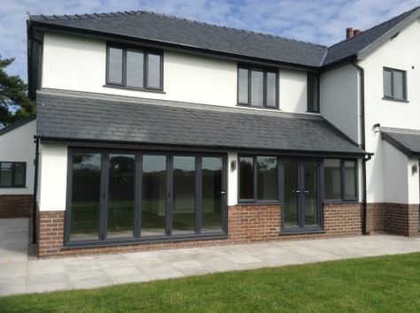 White render, red brick trim, grey windows and grey tile roof Garage Door Trim Ideas, Door Trim Ideas, Garage Door Trim, Rendered Houses, Single Storey Extension, Garden Room Extensions, House Extension Plans, Grey Windows, Trim Ideas