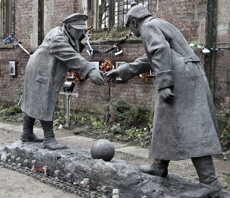 This is a statue by Andy Edwards entitled “All Together Now” which for the next few days will be on display in St Luke’s, Liverpool’s famous “bombed out church”. The figures are about to shake hands standing over a football which relates to the time that British and German soldiers paused, apparently to play football on Christmas Day 1914. The hands do not quite meet which allows one to place a hand between them, joining the act of all too brief sanity on that day. The figures will leave Li.... Christmas Truce, All Together Now, St Luke, Liverpool History, Memorial Statues, Liverpool Home, Liverpool City, Public Sculpture, Shake Hands