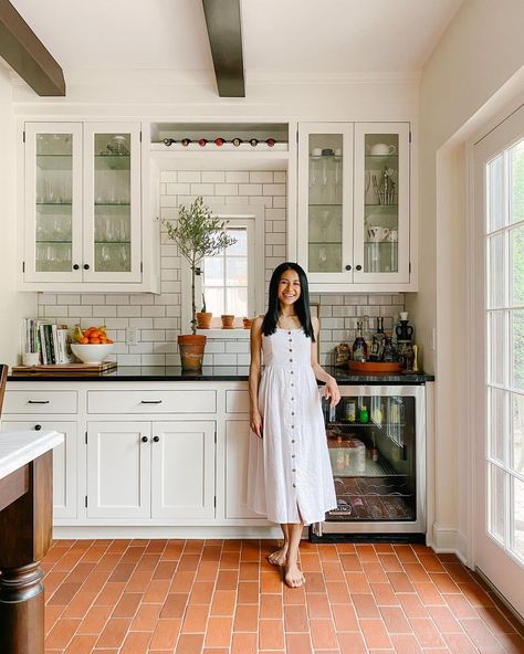 Patti on Instagram: ““Oh that’s different?” “There’s a reason why people don’t install terra cotta tile floors in the midwest.” I guess if we would’ve…” Divided Living Room, Terracotta Tile Floor, Narrow Living Room, Terracotta Floor, Black Countertops, Glass Front Cabinets, Large Kitchen Island, Terracotta Tiles, Living Room Flooring