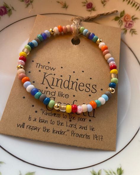 "The KINDNESS bracelet - THROW KINDNESS AROUND LIKE CONFETTI! A colorful reminder to BE KIND, Always! These are made with 4mm seed beads beads accented with 4mm gold filled beads. Each bracelet comes with the \"Kindness Card\" with scripture * Each bracelet color patterns will vary Listing includes ONE Mini Kindness bracelet ONLY - the larger Kindness Bracelet is available in another listing." Bracelet Tags Ideas, Diy Bead Bracelet Ideas, Kindness Bracelets, Easy Beaded Bracelets, Christmas Bracelet Ideas, Prayer Beads Diy, Selling Bracelets, Kindness Gifts, Blessing Bracelet