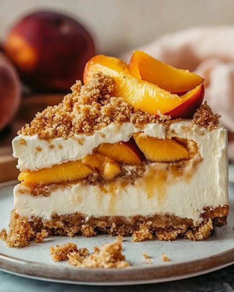 🍑 Peach Crumble Cheesecake 🍑 This Peach Crumble Cheesecake is a delightful summer dessert, featuring a creamy cheesecake filling layered with juicy peaches and a sweet brown sugar streusel. Topped with cinnamon whipped cream, it’s perfect for impressing guests! Ingredients For the Crust: 1 ¾ cups graham cracker crumbs (about 14 graham crackers) 🍪 ⅛ teaspoon salt 🧂 6 tablespoons unsalted butter, melted 🧈 ¼ cup granulated sugar 🍬 For the Peach Filling: 5 cups sliced and peeled peaches (about 5... Cheesecake Peach, Cinnamon Whipped Cream, Crumble Cheesecake, Peach Filling, Peach Crumble, Cheesecake Filling, Creamy Cheesecake, Summer Dessert, Graham Cracker Crumbs