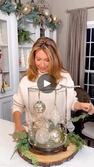 3.5K views · 115 reactions | Illuminated Ornament Centerpiece ✨is a magical woodland chic arrangement for any table in your home! To shop>> https://liketk.it/4X246 Using a branch from my yard, I crafted an easy, elegant and nature inspired centerpiece with baubles, wood charger, moss, and fairy lights. #christmascenterpiece #christmasdiy #woodlandchristmas #christmasdecoratingideas #holidaydecor | Janine Graff Bauble Table Decorations, Christmas Decor Ideas For Table Top, Glass Vase Christmas Centerpiece, Large Glass Vase Christmas Decor, January Table Centerpieces, Table Centerpieces For Home Christmas, Christmas Tree Table Centerpieces, Christmas Tablescapes Ideas Centerpieces, Christmas Vase Arrangements