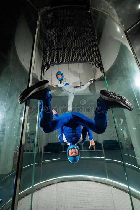 A man and a woman enjoy flying together in a wind tunnel. Free fall simulator stock photos Flying Together, Wind Tunnel, Free Falling, Revlon, A Man, Vision Board, A Woman, Stock Images, Stock Photos