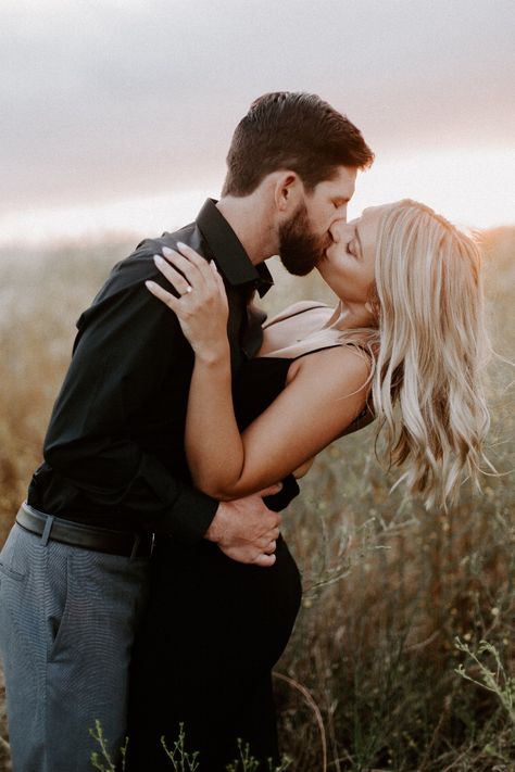 Engagement photos black dress Fall Engagement Pictures Black Outfit, Black Dress Couple Outfit Engagement Photos, Engagement Photos With Black Dress, Engagement Shoot Black Dress, Engagement Pictures Black Dress, Black Outfit Photoshoot Couple, Beach Engagement Photos Black Dress, Engagement Photo Black Dress, Black Dress Beach Photoshoot Couple