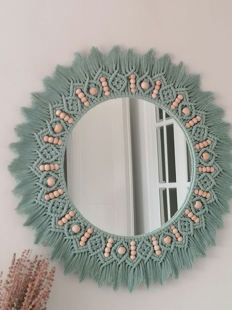 Our Green beaded mirror can complement the bohemian style of your home or be a good start for your soft style. Our handmade macramé mirror is perfect for adding a natural feel to your home decor. A perfect gift for yourself and your loved ones. You will feel bohemian style on every wall. Bedroom, hall, children's room will be a unique piece for all your rooms. All products are handmade, Therefore that may be a difference of 1 - 3 cm in size. Size; ▪️ 85 cm whole diameter ( 60 cm diameter ) Mirror Nursery, Macrame Decor Ideas, Macrame Circle, Simpul Makrame, Macrame Hanging Chair, Macrame Mandala, Beaded Mirror, Macrame Mirror, Macrame Supplies