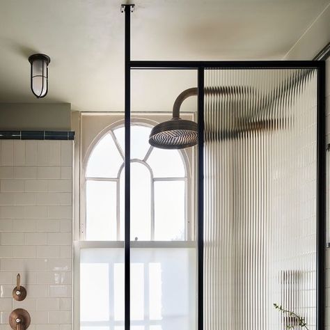 Drummonds Bathrooms on Instagram: "This en-suite bathroom was completely transformed to create a sleek, contemporary shower room. Swathed in faux terracotta, the space needed a total refresh, and the owners wanted the new design to have a classic, masculine feel. Refined, elegant pieces from Drummonds are paired with more decorative elements, such as geometric statement floor tiles and ribbed glass screens, to create a space that feels laid back yet stylish." Bedroom Georgian, Drummonds Bathrooms, Ensuite Bathroom Ideas, White Wall Tiles, Georgian Townhouse, Contemporary Shower, Suite Bathroom, Sunday Style, Ensuite Bathrooms