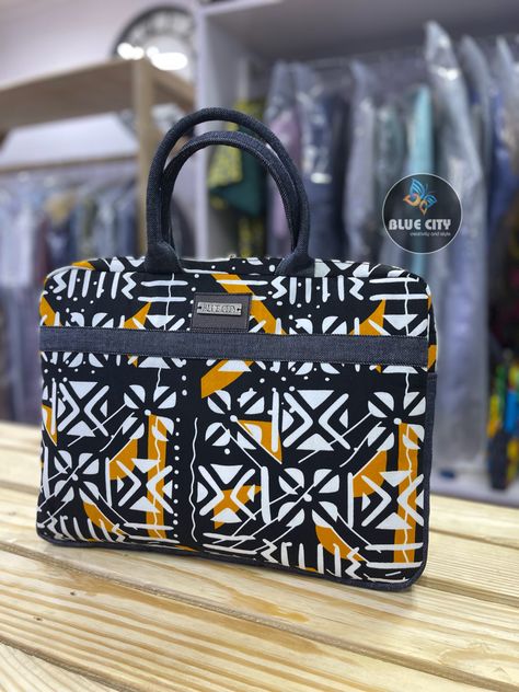 These collection of laptop/handbags are made with quality ankara/African print fabrics and a touch of jeans/leather. Carefully crafted to suit all your clothing and gadgets. Comes in a size of 16 inches by 13 inches. We do wholesale and retail. Send us a WhatsApp message +233240926564 Worldwide shipping assured Ankara Bags Handbags, Laptop Handbags, Ankara Accessories, Ankara Bags, Traveling Bag, African Accessories, Laptop Handbag, Bag Designs, Blue City