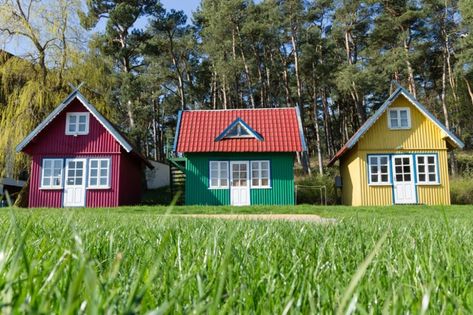 Hidden Costs of Owning a Tiny Home | Reader's Digest Tiny House Village, Diy Tiny House, Tiny House Community, Colorful Houses, Building A Tiny House, Cost To Build, Tiny Cabin, Tiny House Movement, Tiny House Interior