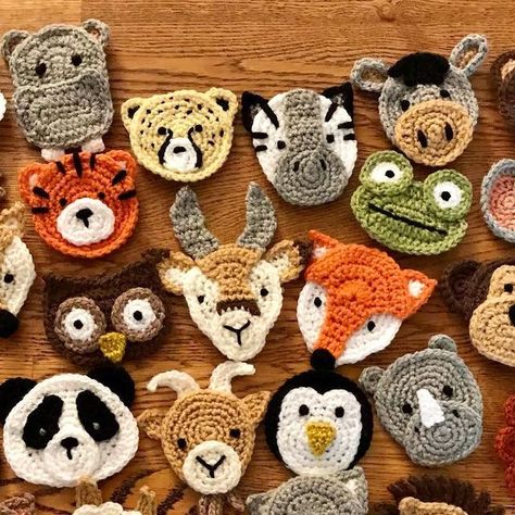 Katy Mitchell | Crochet Designer on Instagram: "All 30 animal appliqués are now finished for my latest design, the Animal Kingdom Blanket 🦁 Here’s the whole gang together! Now to make my mind up which animals are going on which squares and how to arrange them... #animalkingdomblanket Pattern by me 🙋‍♀️ Coming soon! #crochet #crochetproject #crochetdesign #crochetdesigner #crochetpatterndesigner #crochetpattern #crochetanimals #crochetappliques #crochetmotif #crochetersofinstagram #crochetersofig #crochetersoftheworld #instacrochet #crochetgram #crochetrevolution #crochetgirlgang #creativecommunityhub #makersgonnamake #sctreblemaker #lovecrochet #crochetaddict #hookedoncrochet #crochetcrazy #crocheterapia #crochetastherapy #craftastherapy #crochet_relax #crochetideas #crochetinspirati African Granny Square Animals, Crochet Animal Faces, Crochet Animal Motifs, Animal Crochet Blanket, Quick Crochet Patterns, Slap Bracelets, Mind Up, Crochet Creations, Quick Crochet