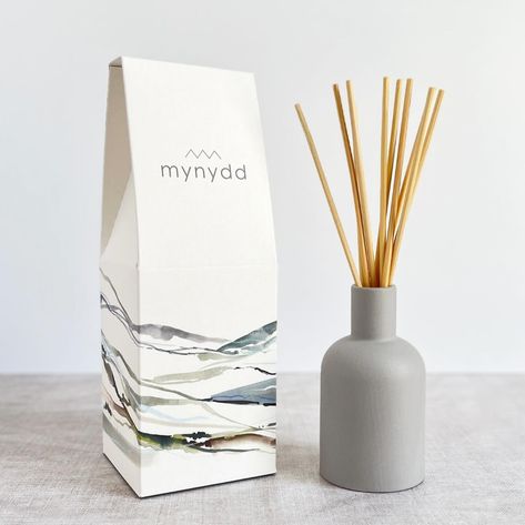 ******NEW LAUNCH****** I’m so thrilled to announce the launch of our new candle and diffuser collection. We’ve been working on this range for a few years now and after a few hiccups earlier in the year we are proud as punch to finally have them here and being received well. There are three scents in the range chosen carefully to evoke the feeling and aromas you may experience in the mountains, the coast and the forest. . Mynydd Môr Coed The packaging is inspired by my studio b watercol... Welsh Words, Ceramic Furniture, Eco Friendly Candles, Textile Wall Art, Ceramic Bottle, Candle Branding, Reed Diffusers, Homewares Shop, Lifestyle Store