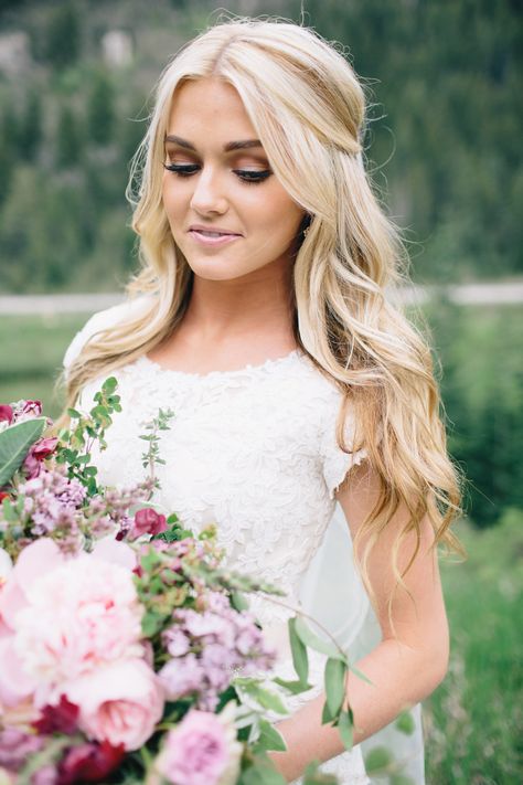 Classic and elegant bridal half up half down hair with voluminous crown. // Gorgeous half up half down bridal hairstyle ideas to impress on your wedding day. // mysweetengagement.com // #wedding #bride #bridal #bridalhair #bridalhairstyle #weddinghairstyles  #halfuphalfdown #hairstyles Hair Curled For Wedding, 2023 Bride Hair Trends, 2023 Bridal Hair With Veil, Parted Half Up Half Down Hair, Bridal Hair With Halo Extension, Half Up Wedding Hairstyles Front View, Bridal Hair Loose Waves, Bridal Hair Half Up Half Down Front View, Off Shoulder Wedding Dress Hairstyle